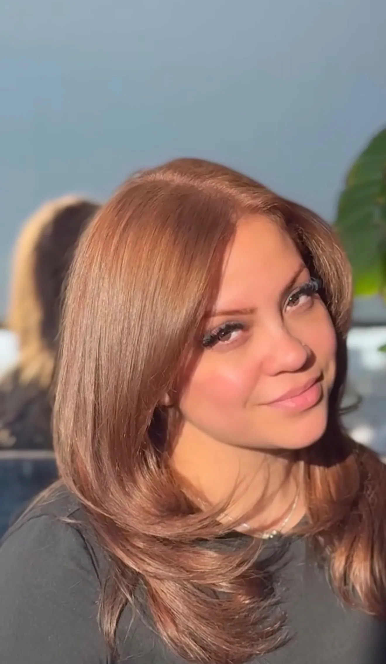 Bronze copper hair color with face-framing blowout by Alma Juarez at The Mane Allure, Houston